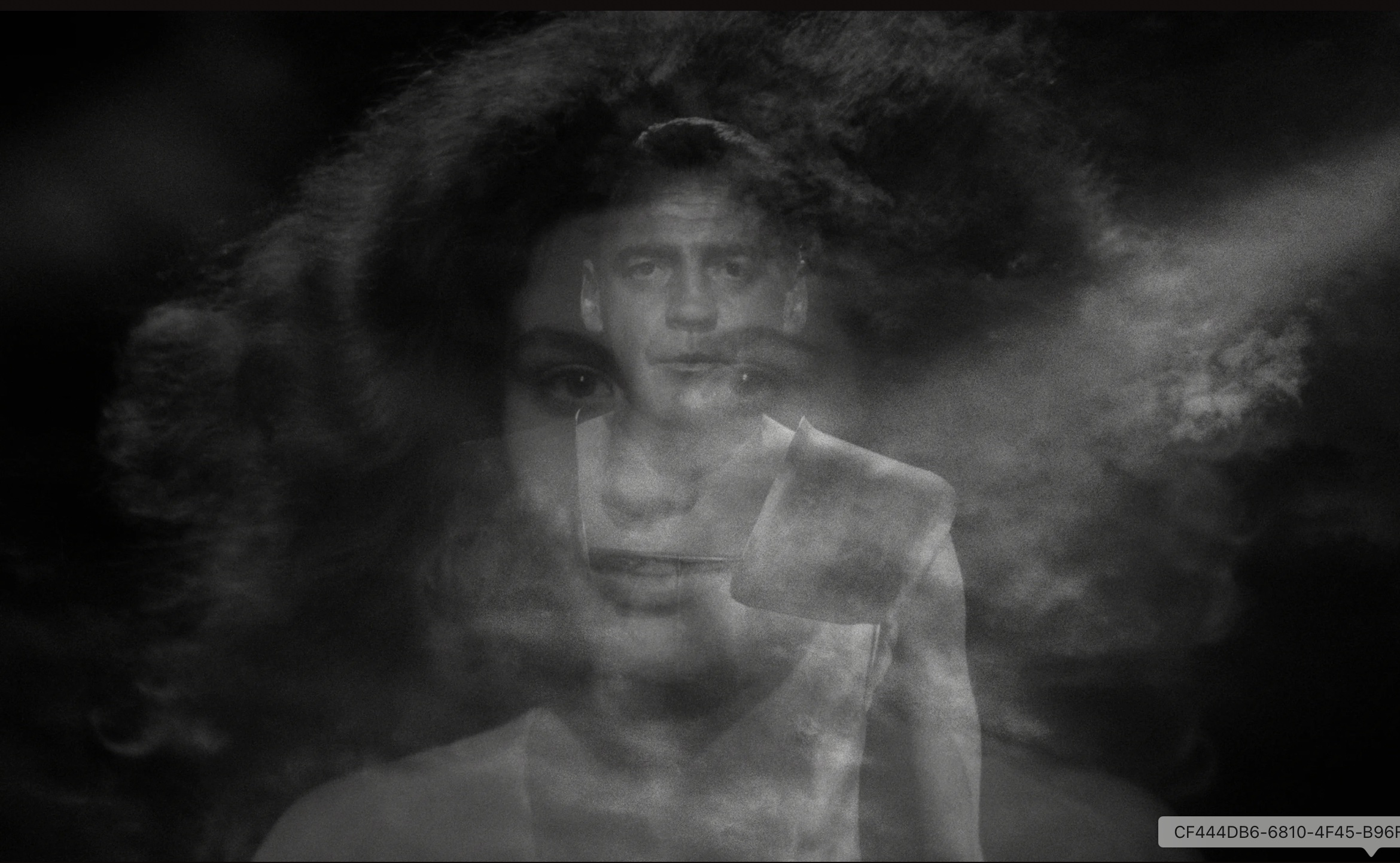 Layered black-and-white faces from Wings of Desire